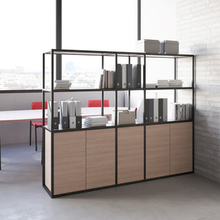 Lifestyle image of a Buronomic Alto bookcase in black and wire oak as room divider by large windows