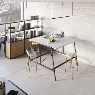 Lifestyle image of a Buronomic Alto bookcase in black and Nebraska by a high table, seen from above