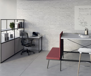 Lifestyle image of white Buronomic Alto bookcases with desk extension in a white office with red bench