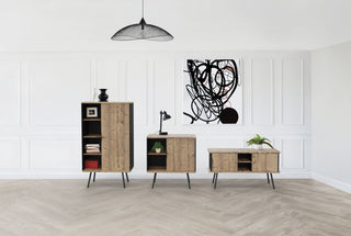 Lifestyle image of Buronomic Alto hinged door cabinets in black and Nebraska against white panelling