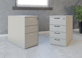 Buronomic Comfort desk-height pedestals in wire oak and white side by side by a window