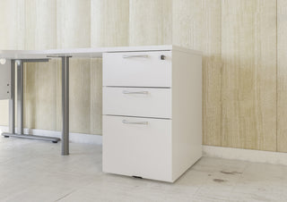 White Buronomic Comfort desk-height pedestal used as support leg under a desktop