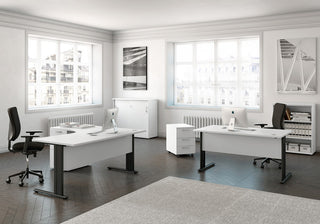 Lifestyle image of white Buronomic Quietude cabinets by desks in a bright office with windows